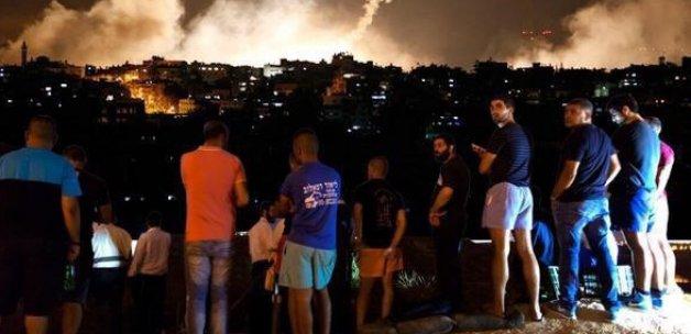 Katil İsrail'in halkı bombardımanı böyle izliyor